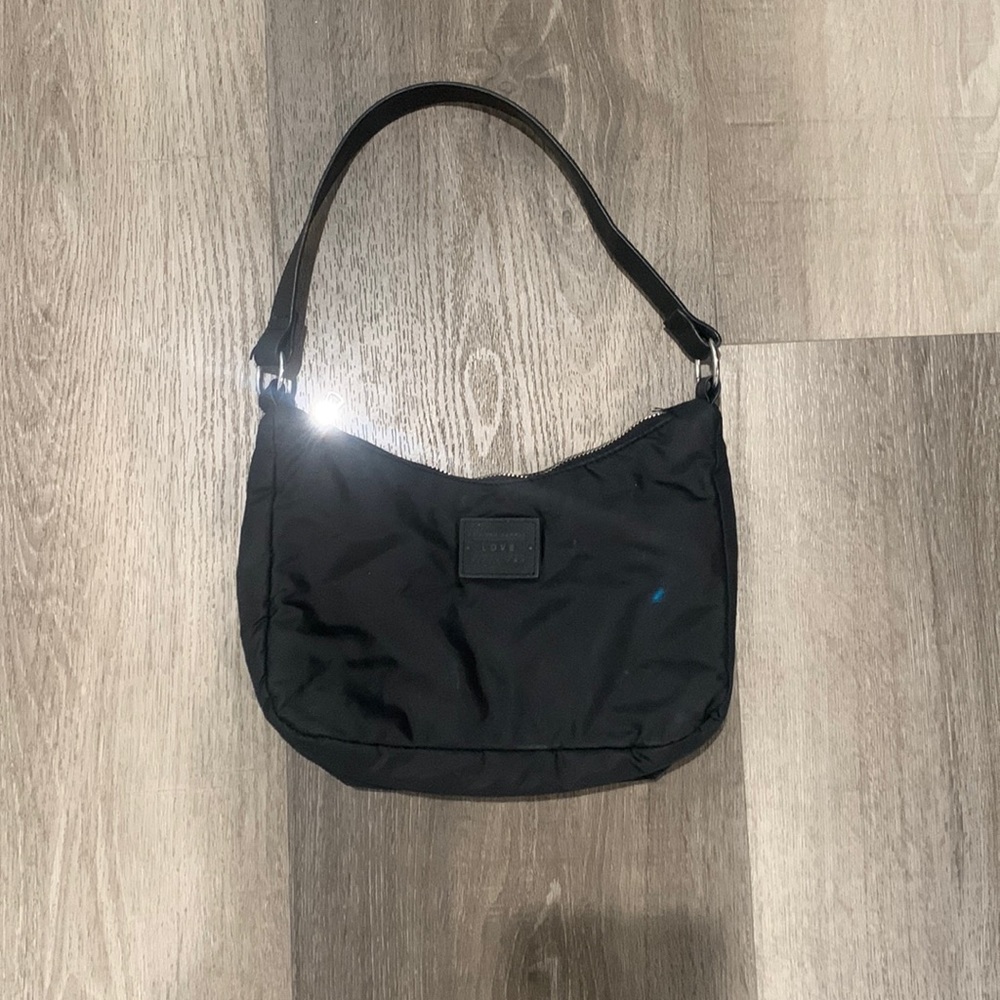 In very good condition and very cute the color is black